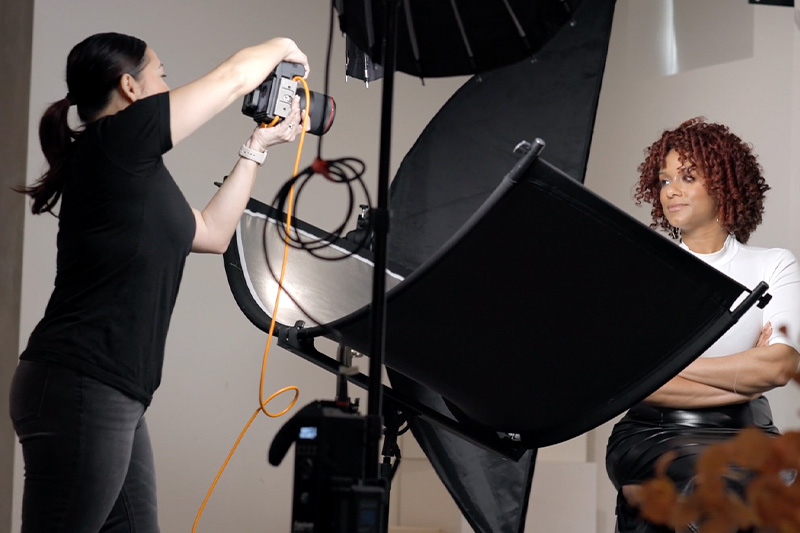 woman taking headshots of another woman